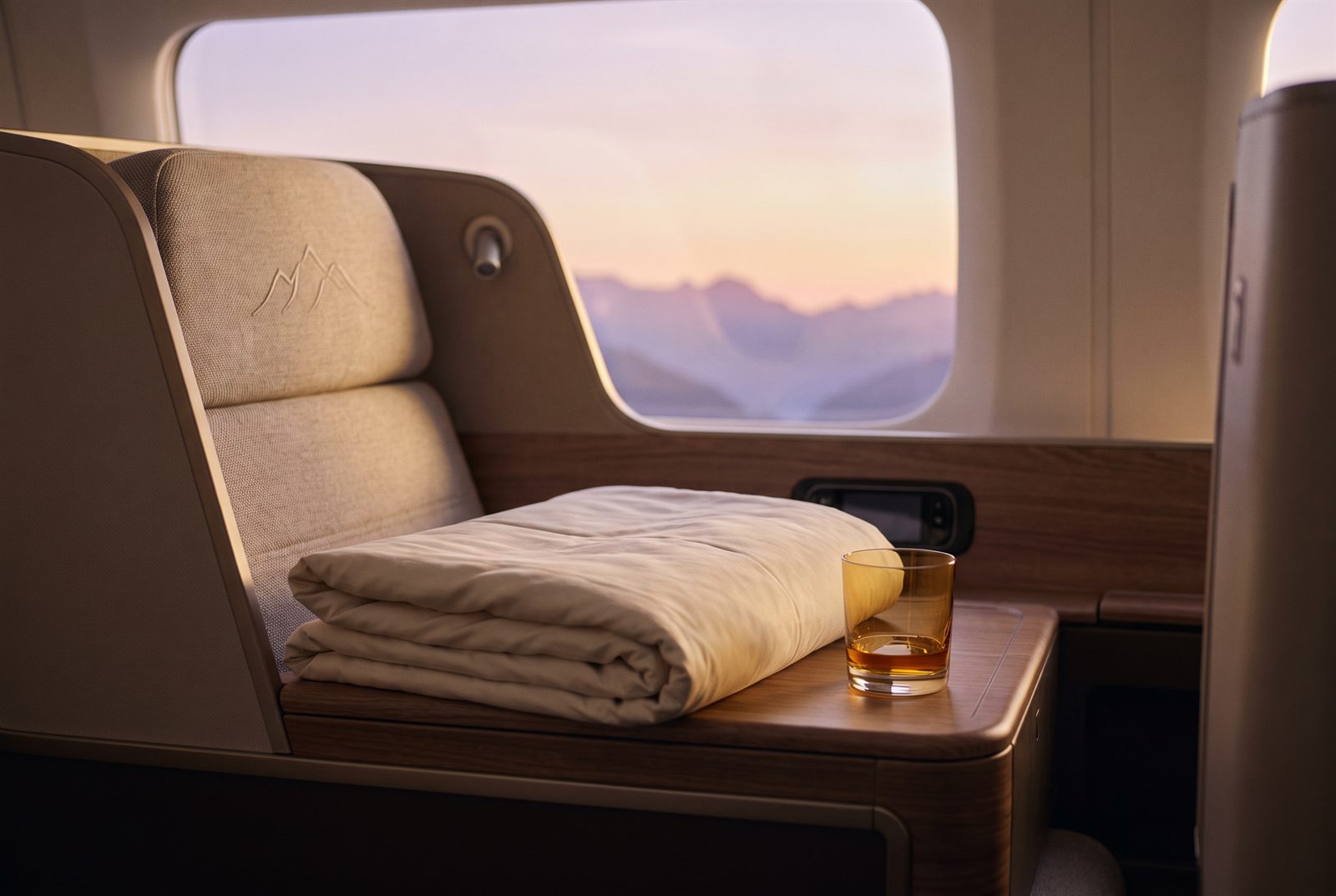 Summit Business lie-flat suite with alpenglow window light