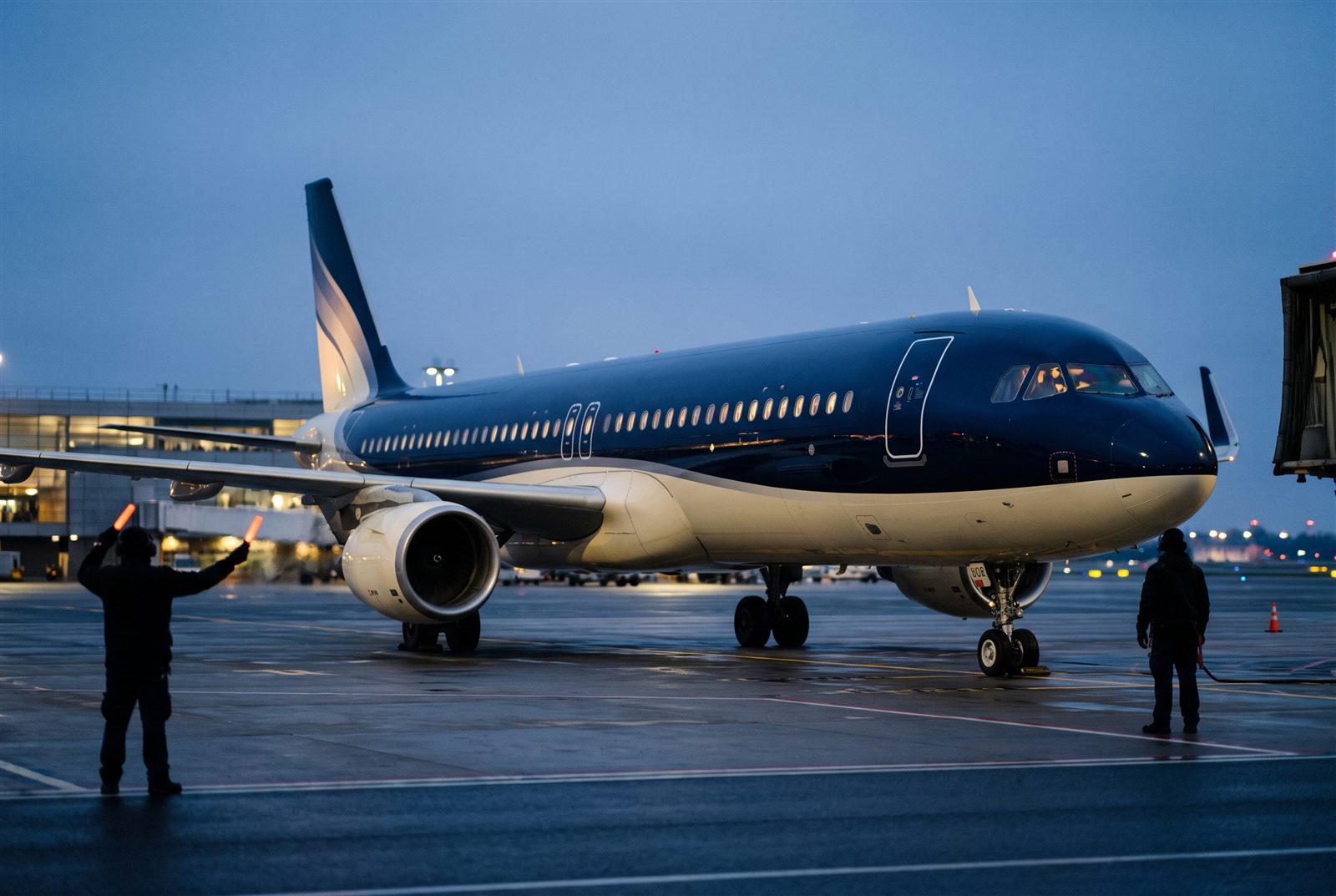 Slalom Airlines ground crew preparing an aircraft at dawn